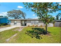 Charming single-story home with fresh exterior paint and a well-maintained lawn, presenting great curb appeal at 2361 Rose St, Sarasota, FL 34239