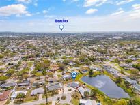 Beautiful aerial view of a neighborhood featuring a nearby pond and easy access to beaches at 3611 22Nd W Ave, Bradenton, FL 34205