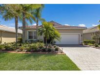 Charming single-story home with mature landscaping, paved driveway, and a two-car garage at 4134 63Rd E Ter, Sarasota, FL 34243