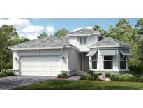 Beautiful single-Gathering home featuring a pristine white exterior, well-manicured landscaping, and an attached two-car garage at 14919 Contenta Loop, Bradenton, FL 34211