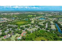 Beautiful aerial view of the community with lush landscaping, ponds, and neighborhood amenities at 5160 Northridge Rd # 206, Sarasota, FL 34238