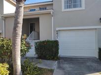 Charming townhome featuring an attached single car garage and a welcoming, elevated front entrance at 6821 Fairview Ter # 6821, Bradenton, FL 34203