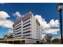 Modern building with multi-colored tinted windows at 1080 Peppertree W Ln # 602, Sarasota, FL 34242