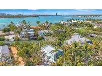 Stunning waterfront homes surrounded by lush tropical foliage with boat docks and ocean access at 111 Faubel St, Sarasota, FL 34242