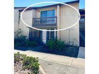 Two-story condo with exterior balcony and sliding glass doors at 2632 Hidden Lake N Dr # E, Sarasota, FL 34237