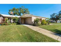 Charming single-story home with well-maintained lawn and walkway leading to the front door at 3289 Fairhaven Ln # 112, Sarasota, FL 34239