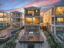 Stunning elevated home with a pool, deck, balconies, and picturesque sunset views at 4305 Marina View Way, Cortez, FL 34215