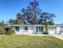 Charming single-story home boasts a well-maintained lawn and attached one-car garage at 240 Pocono E Trl, Nokomis, FL 34275