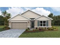 Charming single-Gathering home featuring a stone-accented facade, a two-car garage, and manicured landscaping at 17052 James Trl, Parrish, FL 34219