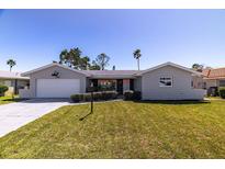 Charming single-story home with a well-manicured lawn and attached one car garage at 7307 14Th W Ave, Bradenton, FL 34209