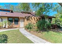 Charming single story home featuring mature landscaping and a welcoming front walkway at 7615 4Th W Ave # 7615, Bradenton, FL 34209