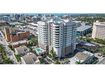 Stunning aerial view of the condominium building with city and ocean views at 1771 Ringling Blvd # 1212, Sarasota, FL 34236