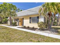 Charming home featuring a welcoming entrance and lovely landscaping at 2403 Aspinwall St, Sarasota, FL 34237