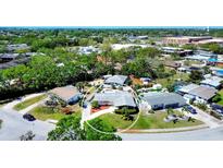 A lovely single-story home with a private pool, driveway, landscaped yard, and a white perimeter fence at 4008 Cape Vista Dr, Bradenton, FL 34209