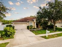 Charming single-story home featuring a well-maintained lawn and attached two-car garage at 4706 Cayo Costa Pl, Bradenton, FL 34203