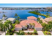 Amazing aerial view of home with private dock, waterway, marina and open bay access at 805 3Rd E St, Palmetto, FL 34221