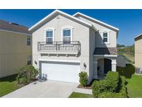 Charming two-story home with a balcony, two-car garage and landscaped yard at 108 San Avellino Ct, Bradenton, FL 34208