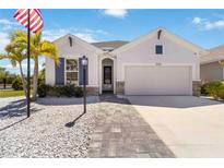 Charming single-Gathering home with well-manicured lawn and inviting stone accents at 3926 Sunshine Pine Ave, Bradenton, FL 34203