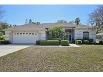 Charming single-story home with well-maintained landscaping and a two-car garage at 610 147Th St E, Bradenton, FL 34212