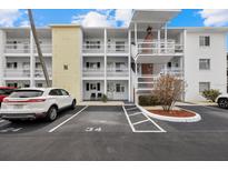 Condo building featuring multiple levels and parking, offering a convenient and accessible living space at 1536 Leisure Dr # N4, Bradenton, FL 34207