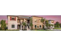 Beautiful exterior of a two-story condo building featuring well-maintained landscaping, and a private balcony at 23819 Collina Way # 202, Port Charlotte, FL 33980