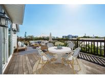 Exterior deck with seating, tables, decor and scenic views at 5512 Avenida Del Mare, Sarasota, FL 34242