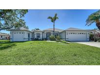 Charming single-story home with a well-manicured lawn and inviting curb appeal at 626 Magellan Dr, Sarasota, FL 34243