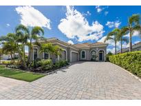 Inviting single-Gathering home with a paver driveway and well-maintained landscaping at 16734 Collingtree Xing, Lakewood Ranch, FL 34202