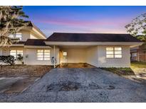 Charming condo showcasing a well-maintained exterior with a covered parking area and inviting curb appeal at 206 Elliot Ave # 137, Sarasota, FL 34232