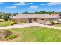 Well-maintained ranch style home with a two car garage, lush lawn and mature landscaping at 6820 19Th W Ave, Bradenton, FL 34209