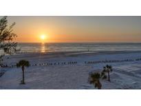 Sunset on the beach, showing a tranquil scene and beautiful colors reflecting on the sand and water at 20 Whispering Sands Dr # 406, Sarasota, FL 34242