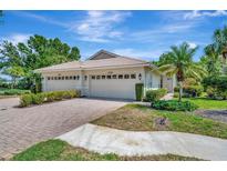 Charming single Gathering home featuring a two-car garage, well manicured yard, and a tile roof at 4344 Nizza Ct, Venice, FL 34293