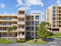 Exterior shot of condo buildings featuring multiple balconies, landscaping and accessible parking at 4440 Fairways Blvd # 210, Bradenton, FL 34209