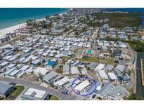 Panoramic aerial view of the community, showcasing proximity to the beach and waterways at 2601 Gulf N Dr # B24, Bradenton Beach, FL 34217