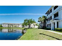 Beautiful condo complex with a waterfront view and a lush green lawn at 4802 51St W St # 319, Bradenton, FL 34210