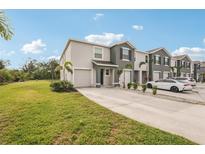 Charming townhome with well-manicured lawn, driveway and attached garage for easy access at 8600 Milestone Dr, Sarasota, FL 34238