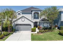 Charming two-story home boasts a well-maintained lawn and an attached two-car garage at 6210 Laurel Creek Trl, Ellenton, FL 34222