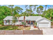 Charming single-story home with landscaped yard and a classic Florida aesthetic at 2425 21St St # B, Sarasota, FL 34234