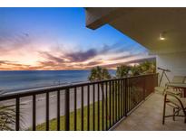 Relax on the balcony with stunning views of the beach at sunset in this beachfront condo at 3235 Gulf Of Mexico Dr # A305, Longboat Key, FL 34228