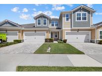Charming townhome featuring a manicured lawn and inviting two-car garage, perfect for comfortable living at 3664 Course Dr, Sarasota, FL 34232