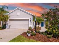 Charming single-story home with a well-maintained front yard and two car garage at 4162 Deep Creek Ter, Parrish, FL 34219