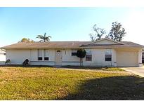 Charming single-story home with a well-maintained lawn and inviting curb appeal at 6309 35Th W Ave, Bradenton, FL 34209