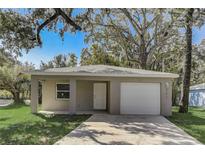 Charming single-story home with a well-maintained lawn and attached one-car garage at 842 31St E Ave, Bradenton, FL 34208