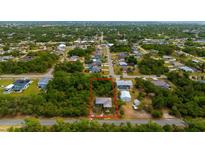 Aerial shot of the neighborhood with the property outlined in red at 3320 Audette St, Port Charlotte, FL 33948