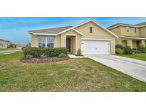 Charming single Gathering home featuring a well maintained lawn, tasteful landscaping and a two-car garage at 15207 Peaceful Bull Pl, Bradenton, FL 34212