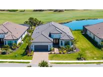 Beautiful single-story home featuring a well manicured lawn, landscaping and a two car garage at 3568 Santa Caterina Blvd, Bradenton, FL 34211