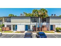 Charming townhouse with a blue front door and beautiful landscaping and private fenced in patios at 4001 Beneva Rd # 343, Sarasota, FL 34233
