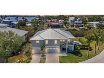 Beautiful two-story home boasts a two-car garage, brick driveway, and well-maintained landscaping at 4109 Cobia Ct, Palmetto, FL 34221