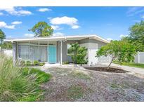 Charming single-story home showcasing its freshly painted exterior and well-maintained landscaping at 4801 Sarasota Ave, Sarasota, FL 34234