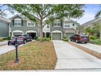 Charming townhome featuring well-maintained landscaping, a two-car garage, and a welcoming entrance at 7180 83Rd E Dr # 6-5, Bradenton, FL 34201